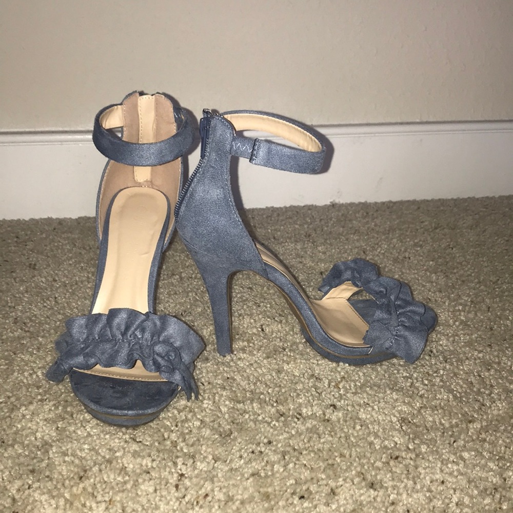 Heeled light blue sandals.